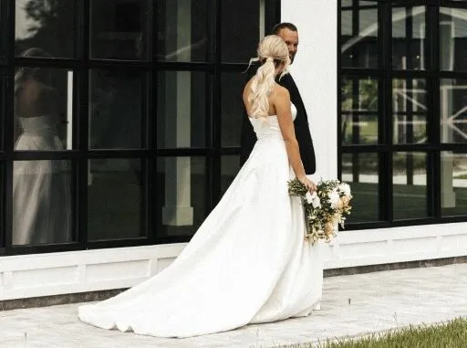 A Florida bride and groom standing in front of a Florida wedding venue.